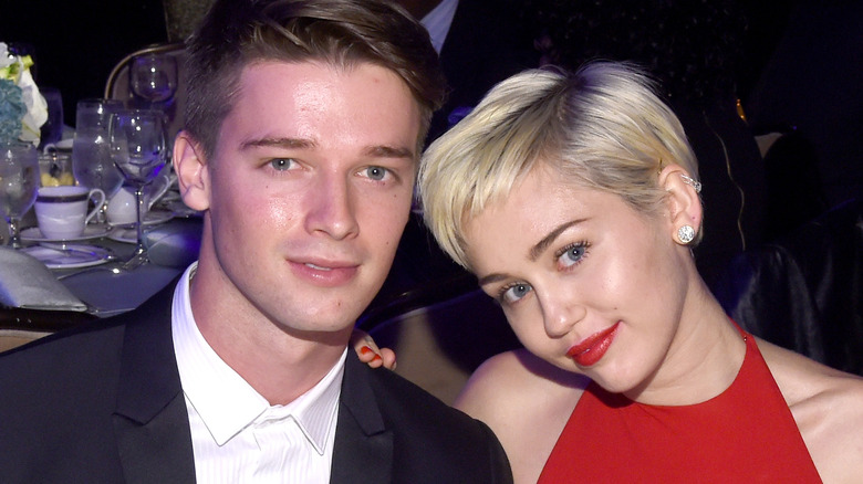 Patrick Schwarzenegger posing with Miley Cyrus