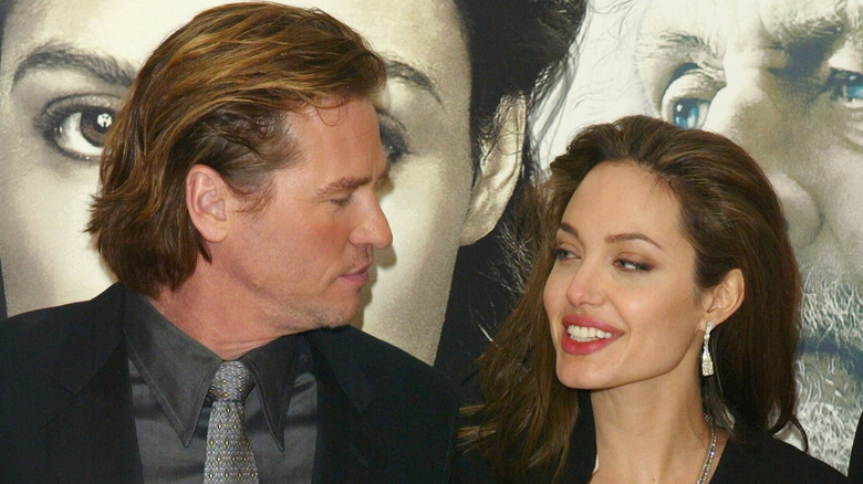 Val Kilmer and Angelina Jolie looking at each other