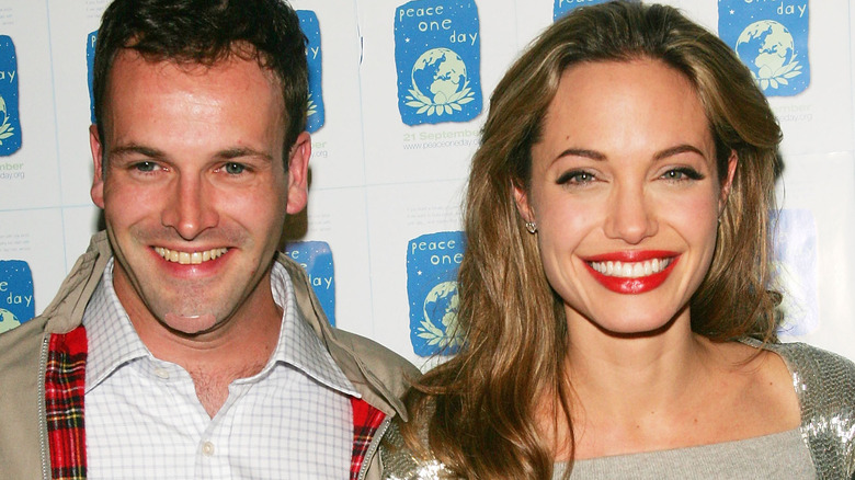 Jonny Lee Miller and Angelina Jolie smiling