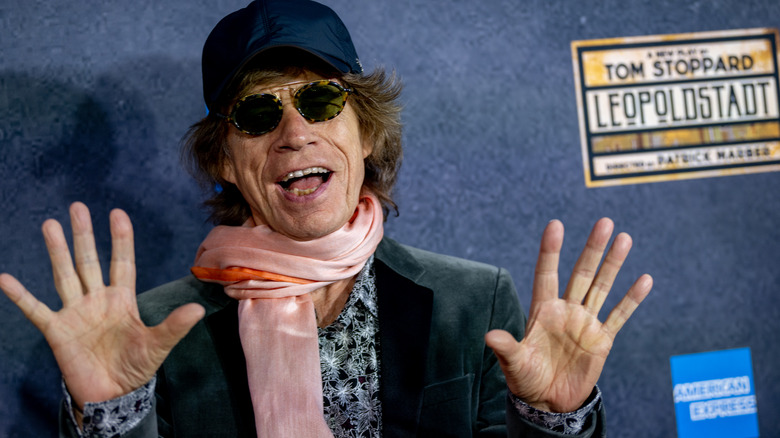 Mick Jagger with hands raised