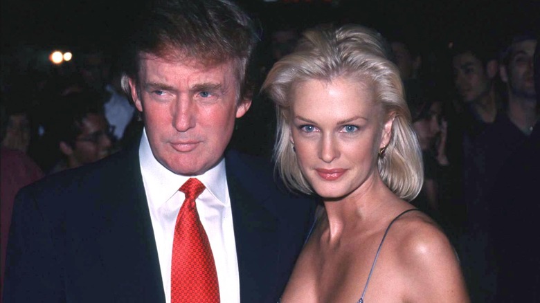 Donald Trump posing with Kylie Bax