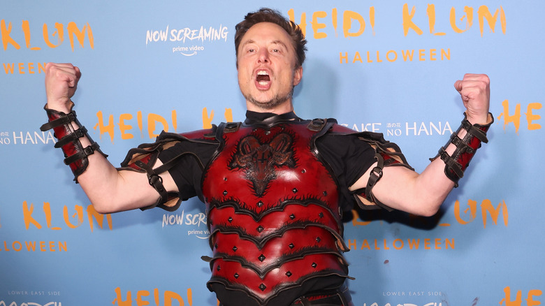 Elon Musk posing red armour