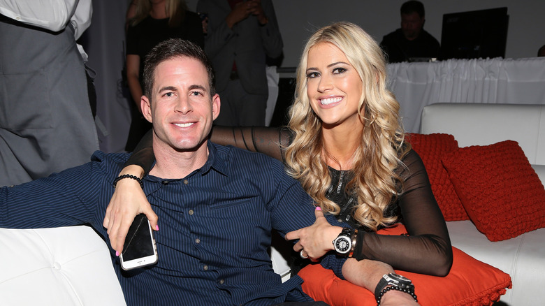 Christina Haack with her arms around Tarek El Moussa