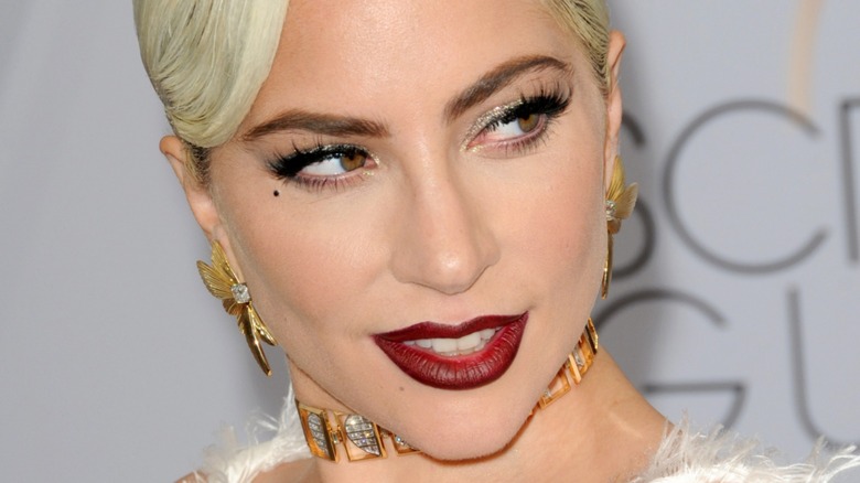 Lady Gaga looking right red lip