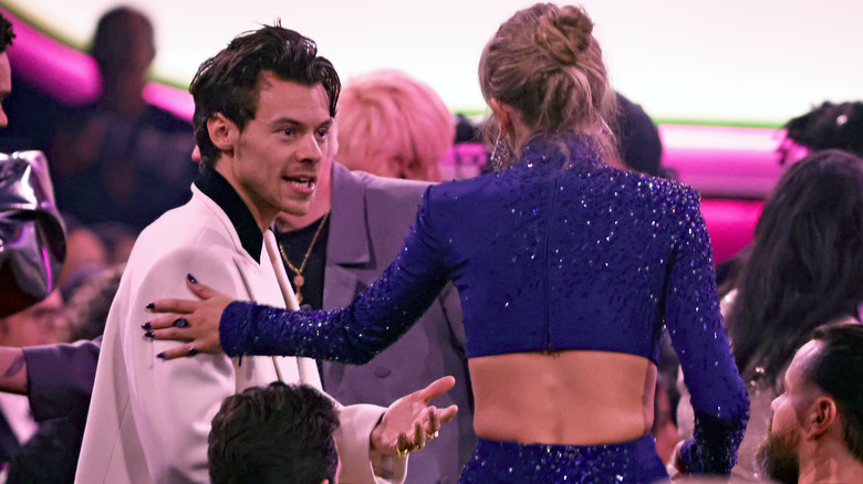 Harry Styles and Taylor Swift talking in 2023