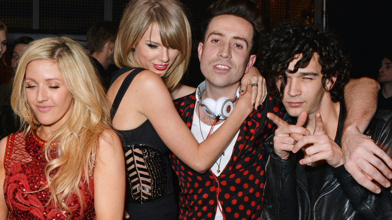 Taylor Swift hugs Matty Healy at a party