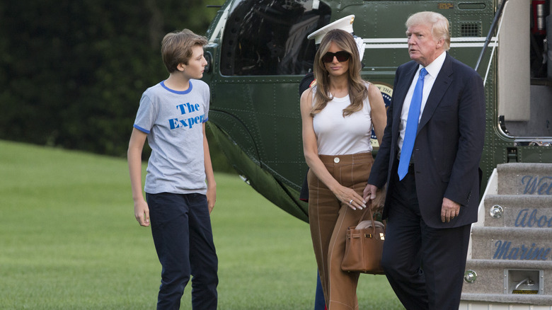Barron Trump looking at Donald Trump