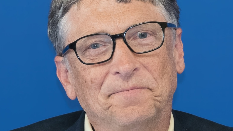 Bill Gates with a neutral expression