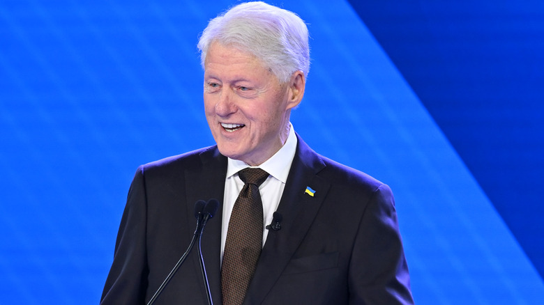 Bill Clinton speaking at podium
