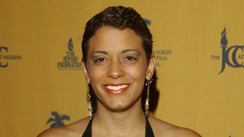Closeup of Cynda Williams smiling on step-and-repeat