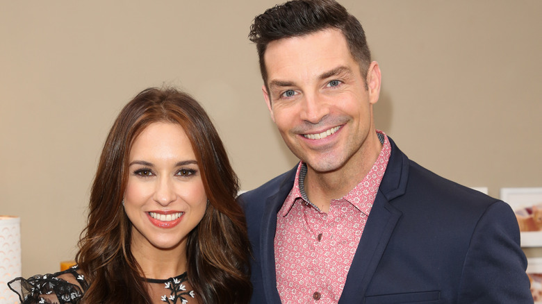 Brennan Elliott and Lacey Chabert smiling 