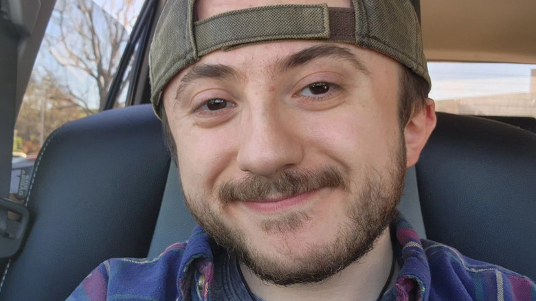 Atticus Shaffer poses for a photo posted to Instagram in 2023