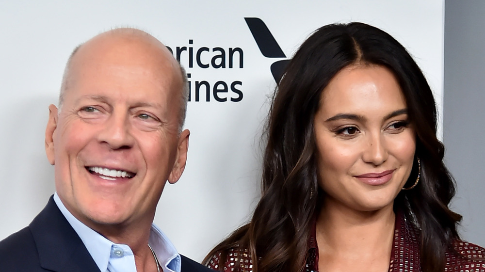 Bruce Willis and Emma Harding on a red carpet