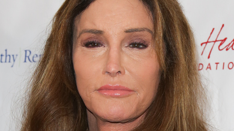 Caitlyn Jenner, 2020 red carpet, not smiling, wearing makeup, brown hair worn down