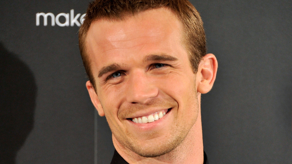 Cam Gigandet smiling at a Burlesque event