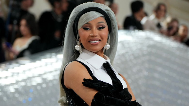 Cardi B smiling long gray hair