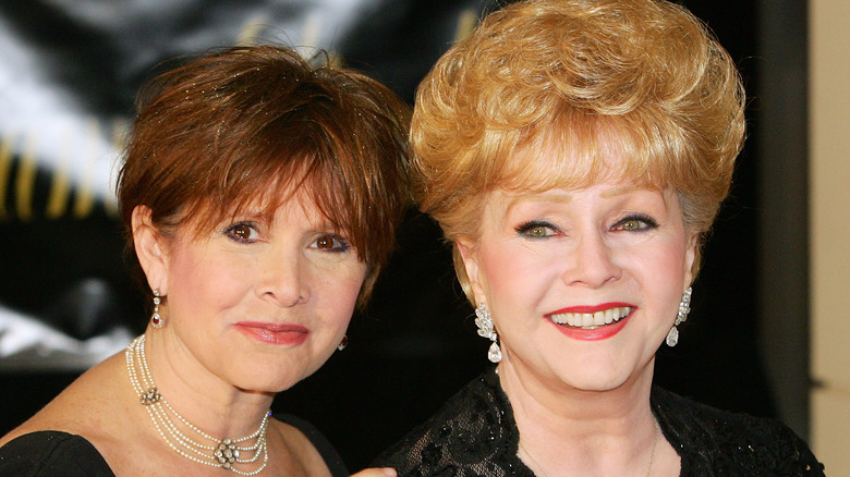 Carrie Fisher, Debbie Reynolds posing