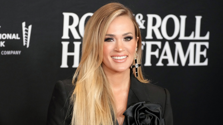 Carrie Underwood smiles at red carpet event