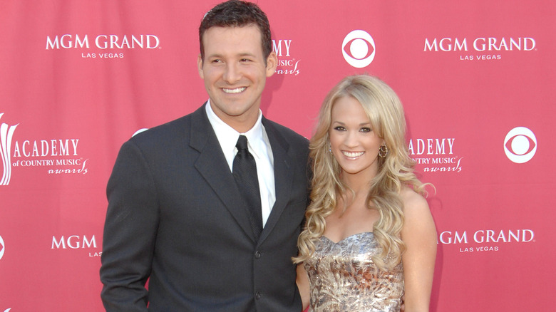 Carrie Underwood and Tony Romo pose together