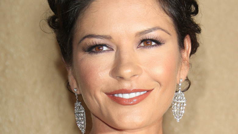 Catherine Zeta-Jones updo hair long diamond earrings