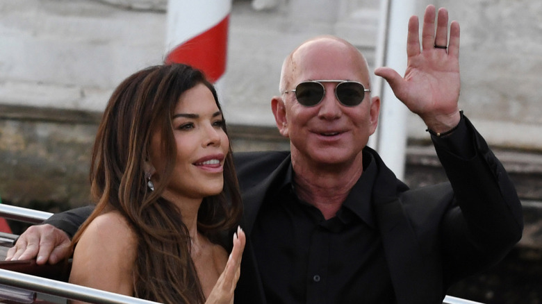 Jeff Bezos and Lauren Sanchez exiting the Hotel Aman