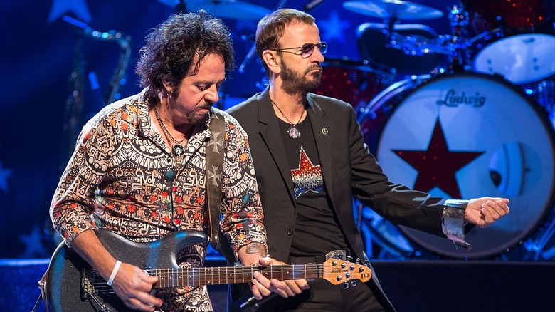 Steve Lukather and Ringo Starr performing together on stage.