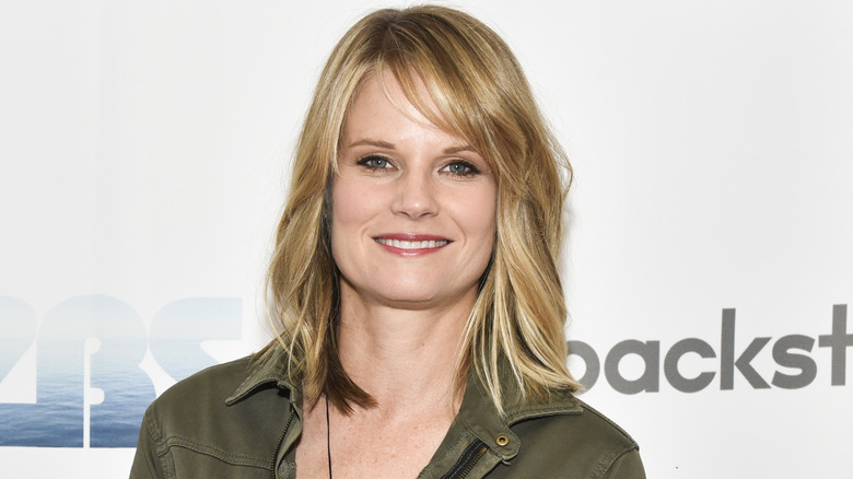Joelle Carter smiling with teeth
