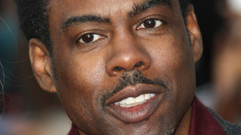 Chris Rock with a neutral expression