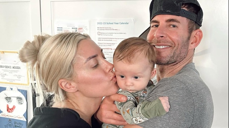 Heather and Tarek El Moussa holding their baby