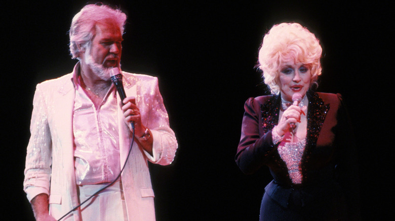 Kenny Rogers singing with Dolly Parton.