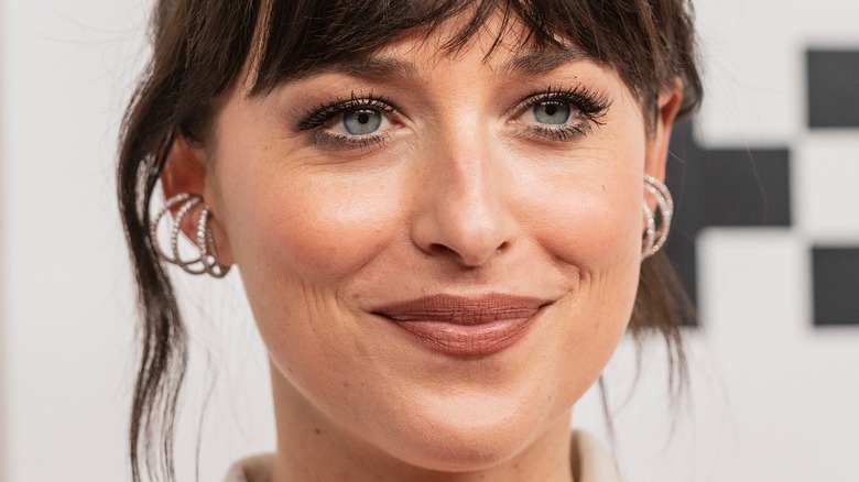 Dakota Johnson posing at a premiere