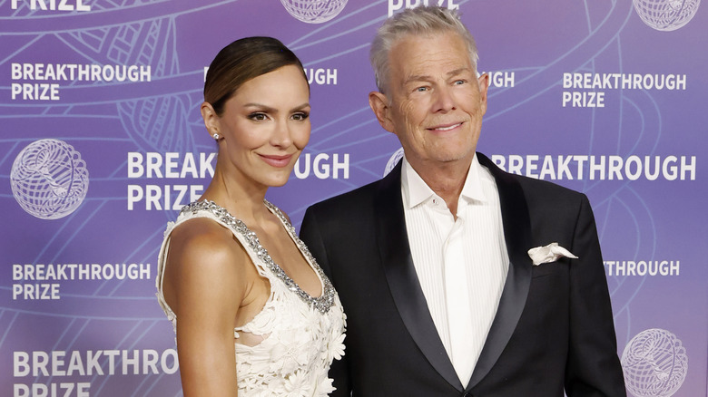 Katharine McPhee and David Foster pose together on the red carpet.