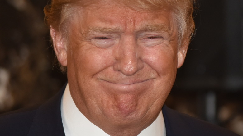 Donald Trump smirks at an event