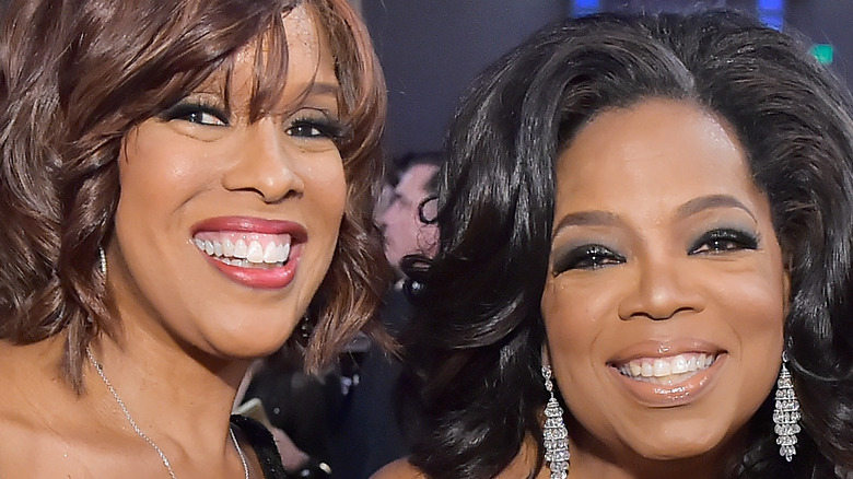 Gayle King and Oprah Winfrey smiling