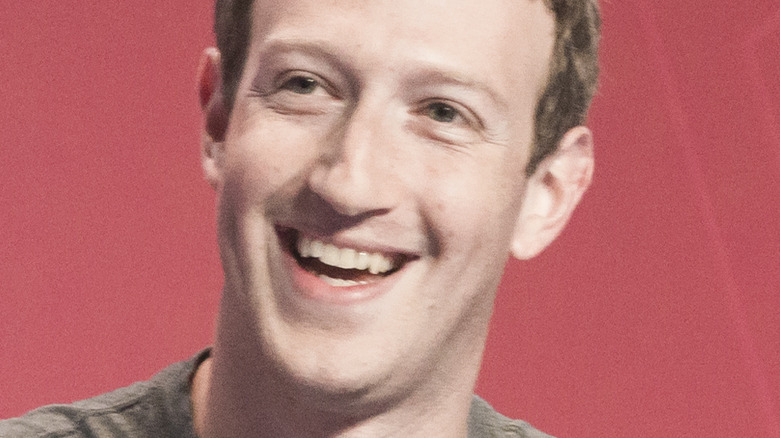 Mark Zuckerberg smiling and looking to the side