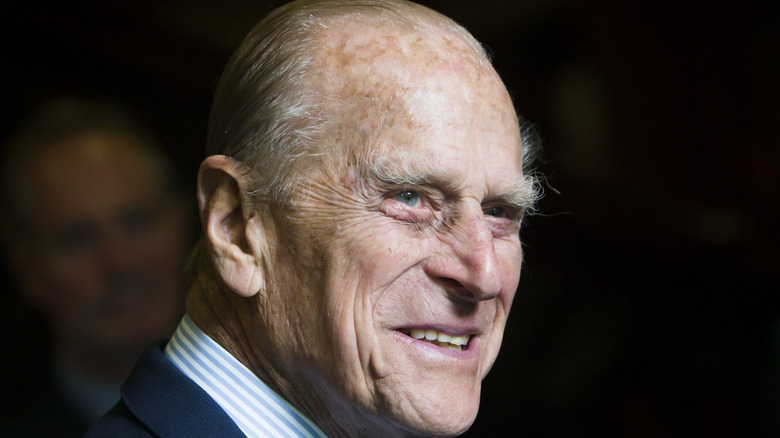 Prince Philip, Duke of Edinburgh smiling during a visit to the headquarters of the Royal Auxiliary Air Force's (RAuxAF) 603 Squadron