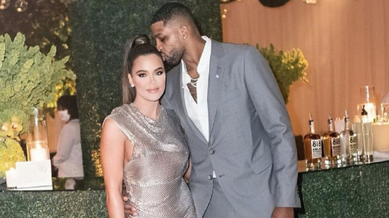 Tristan Thompson kissing Khloe Kardashian's head