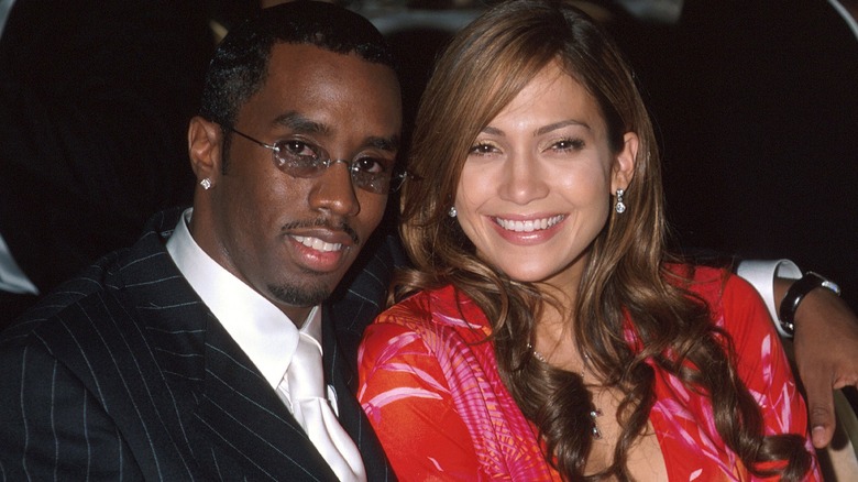 Diddy with his arm around Jennifer Lopez