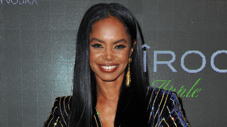 Kim Porter smiling in close-up at red carpet event