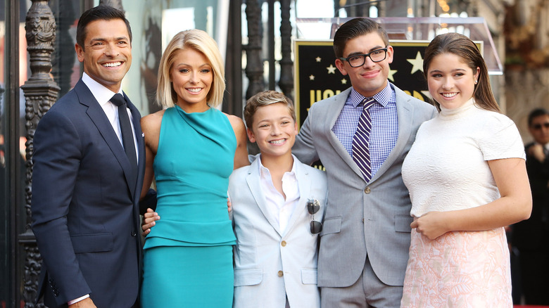 Kelly Ripa and her family posing for a photo