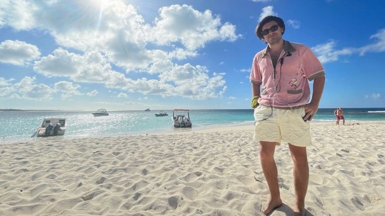 Michael Consuelos standing on the beach