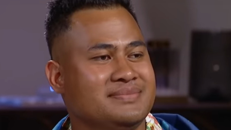 Asuelu Pulaa gives an uncomfortable smile on camera