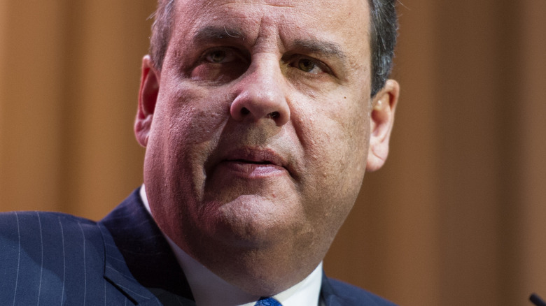 Chris Christie with serious expression at a podium