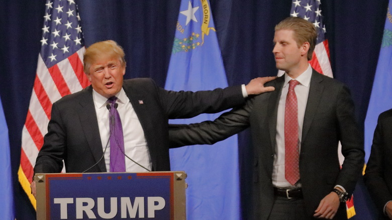 Donald Trump and Eric Trump embracing