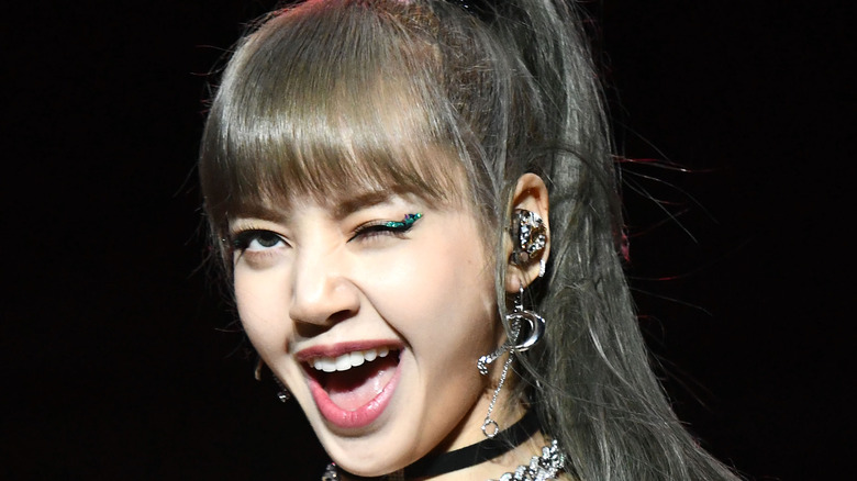 Lisa of Blackpink winks on stage