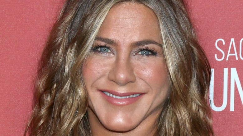 Jennifer Aniston smiles on red carpet