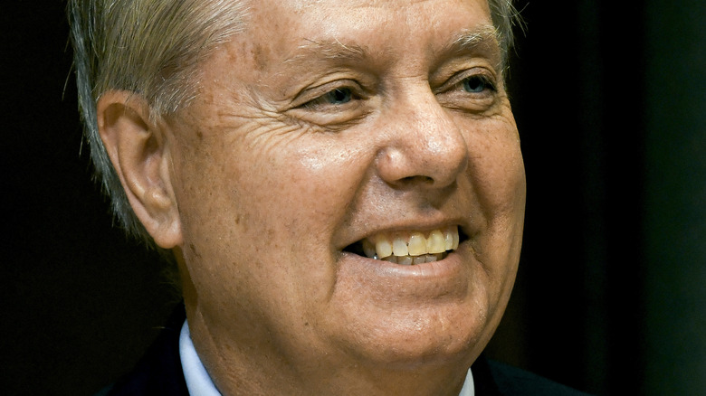 Senator Lindsey Graham smiling and looking to the side