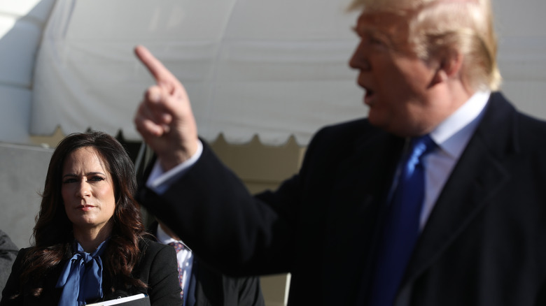 Stephanie Grisham watches Donald Trump 