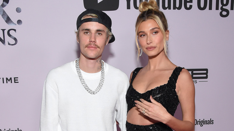 Justin Bieber and Hailey Baldwin smiling at event