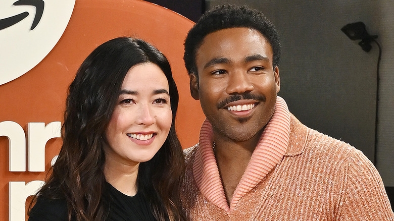 Donald Glover Maya Erskine smiling